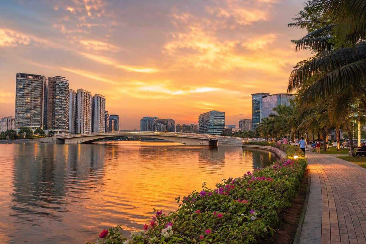 Dhaka's lakefront skyline glowing at sunset